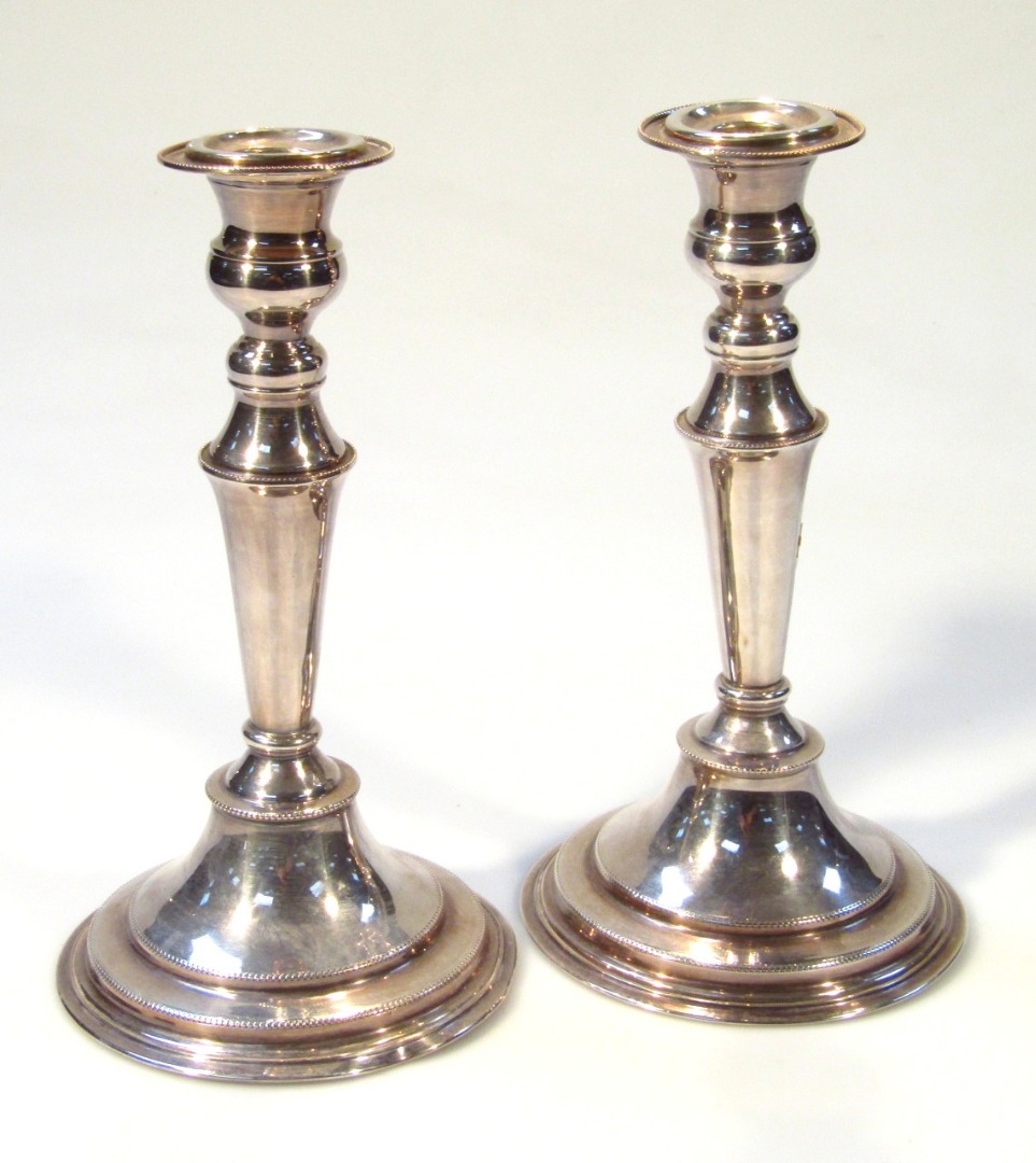 Appraisal: A pair of thC silver plated candlesticks by Elton Co