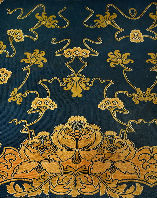 Appraisal: An Art Nouveau throw with sinuous floral design on deep