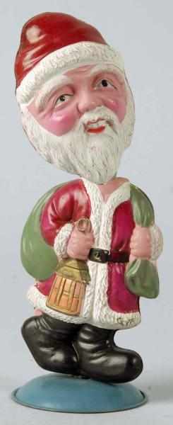 Appraisal: Celluloid Santa Claus Nodder Toy Description Japanese Pre-war Tin base