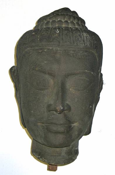 Appraisal: A Khmer style carved stone head of the Buddha minor