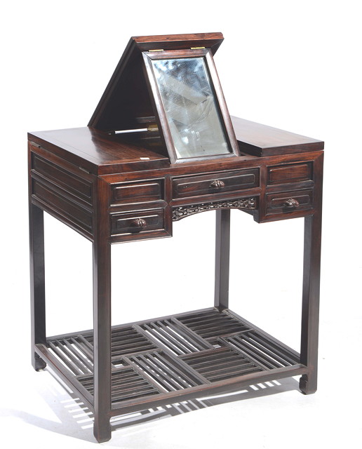 Appraisal: A CHINESE CHERRY WOOD FOLDING DRESSING TABLE having a central