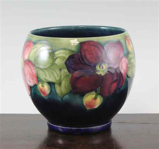 Appraisal: A Moorcroft Clematis pattern ovoid vase post-war with a green