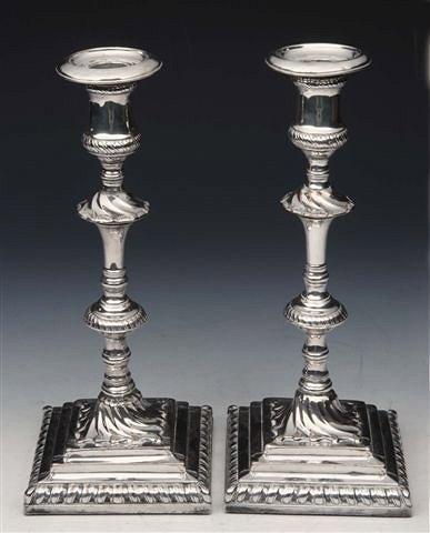 Appraisal: A PAIR OF GEORGE III SHEFFIELD PLATED CANDLESTICKS with loose