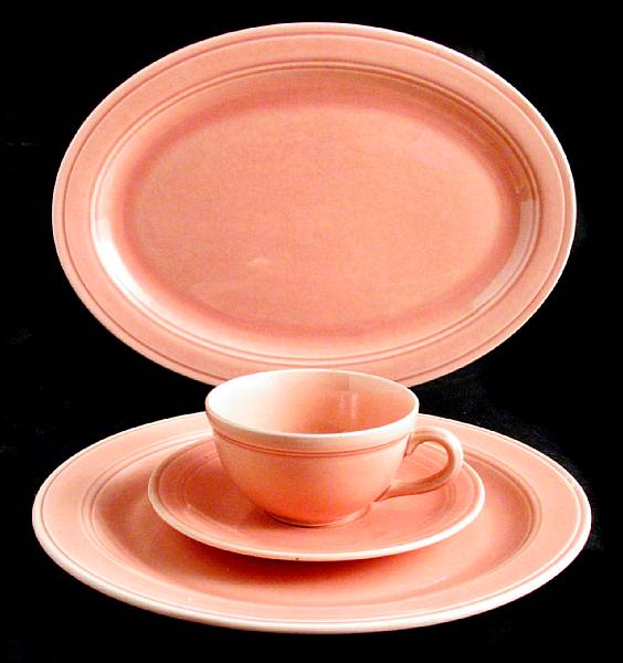 Appraisal: A Vernonware pink glazed partial dinner service for eight comprising