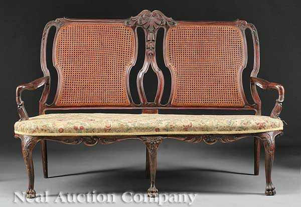 Appraisal: An Antique Georgian-Style Carved and Caned Settee probably Dutch Colonial