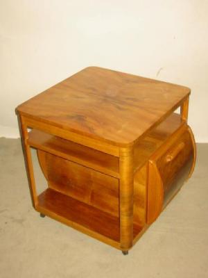 Appraisal: AN ART DECO WALNUT MUSIC TABLE of rounded square form