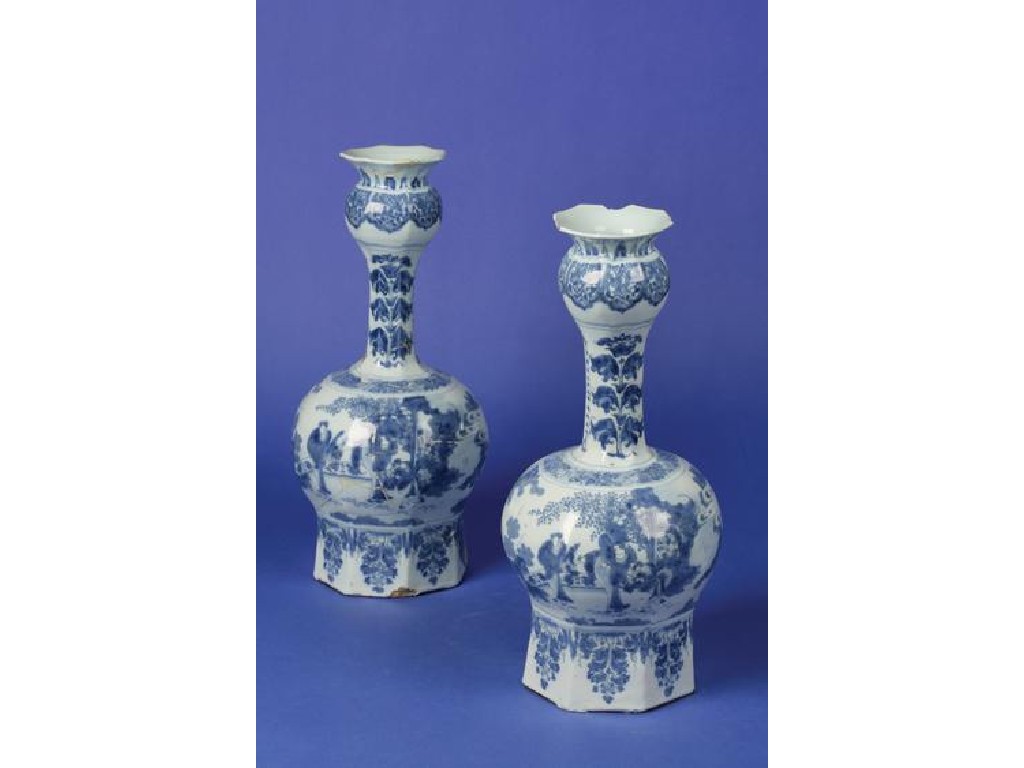 Appraisal: A PAIR OF DELFTWARE BLUE AND WHITE ONION VASES decorated