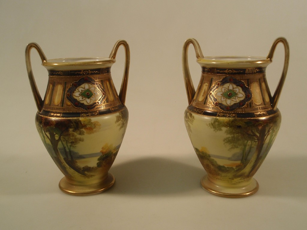 Appraisal: A pair of Noritake two handled vases each painted with