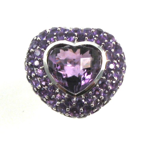 Appraisal: AMETHYST AND FOURTEEN KARAT GOLD RING centering a heart shaped