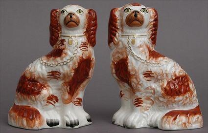 Appraisal: PAIR OF STAFFORDSHIRE RED-SPOTTED SPANIELS Each modeled seated with gilt