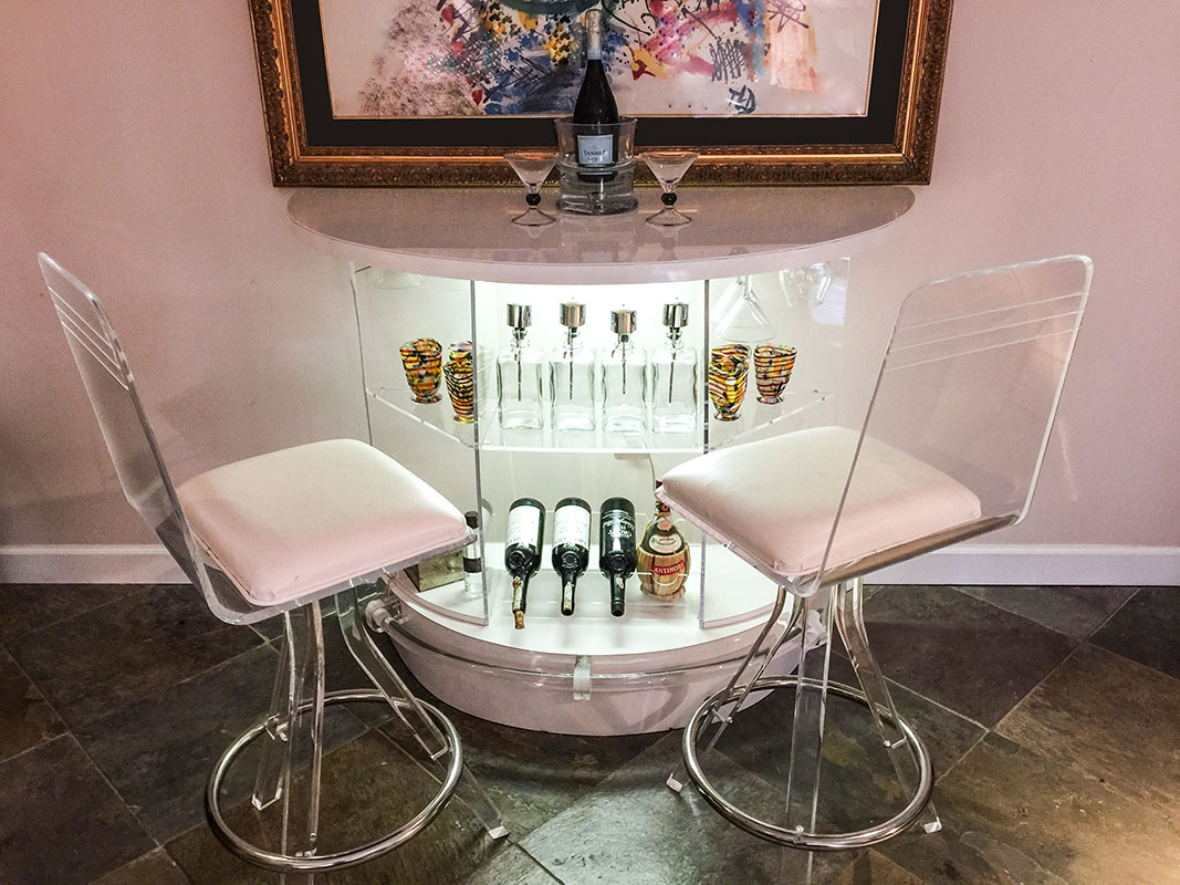 Appraisal: MODERNE LUCITE BAR AND STOOLS Demi lune white Formica-clad top