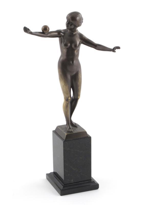 Appraisal: A patinated bronze figure of a woman balancing a ball