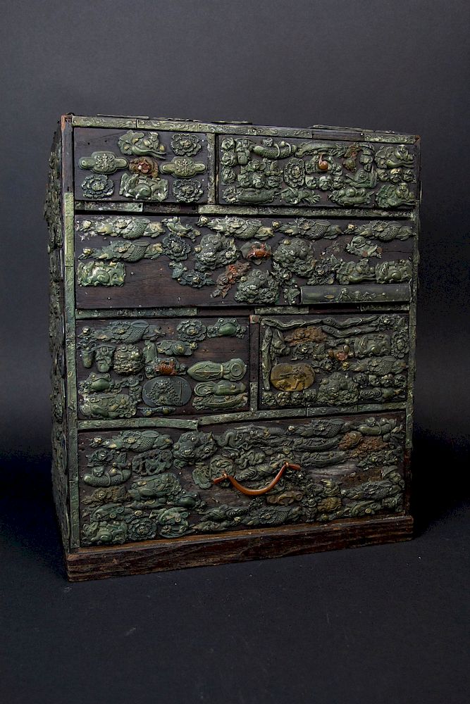 Appraisal: A Japanese Menuki-Mounted Chest Mounted with metal sword ornaments and