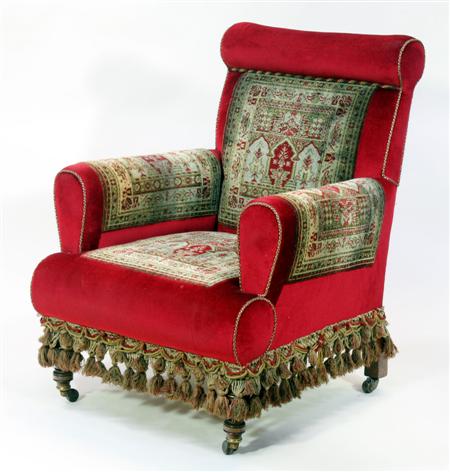 Appraisal: A Victorian red upholstered carpet chair the cushioned back arms