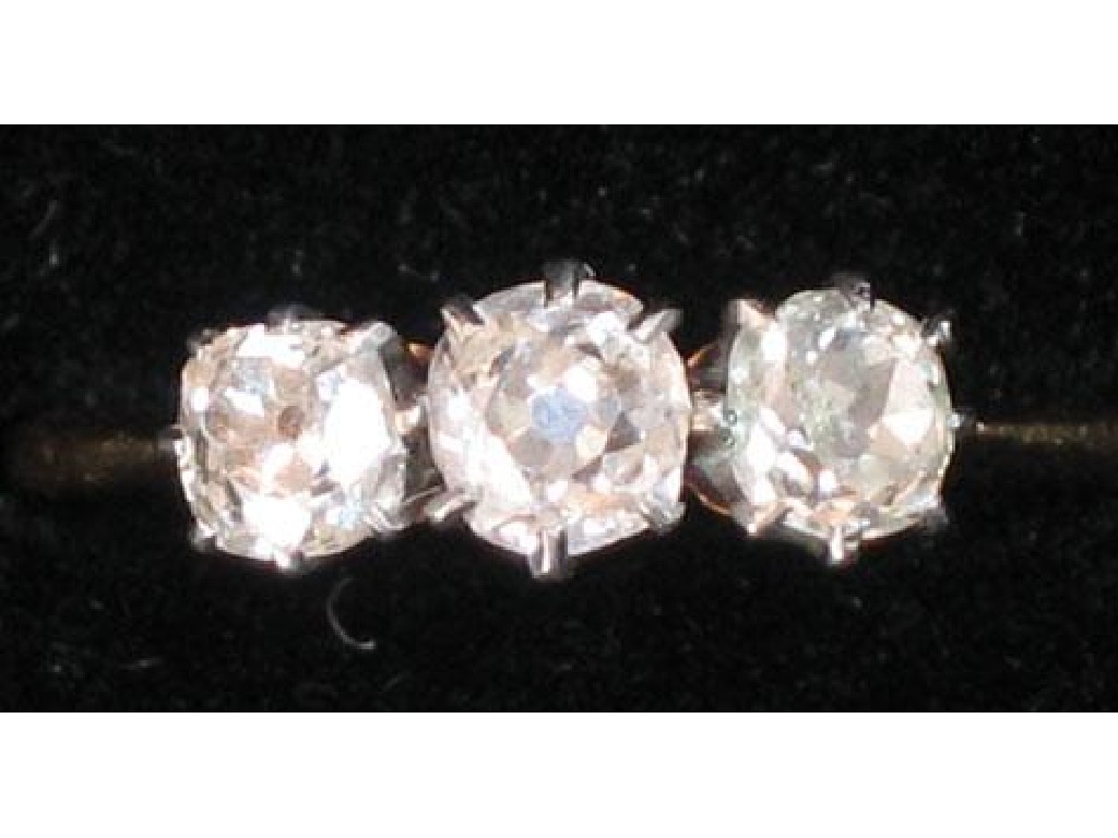 Appraisal: A THREE STONE GRADUATED DIAMOND RING the three round old-cut