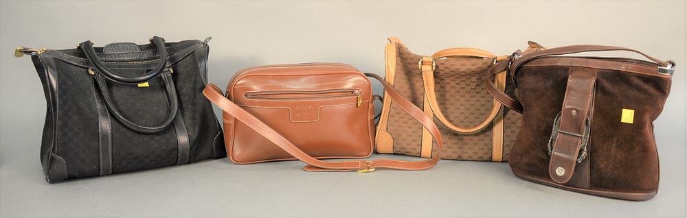 Appraisal: Four Gucci purses to include black Gucci bag tan Gucci