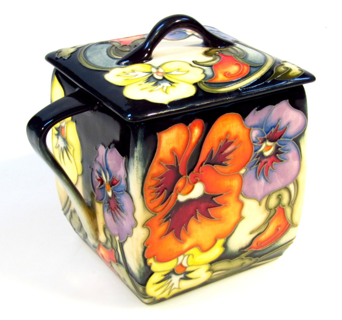 Appraisal: A Moorcroft pottery Clementine Pansy pattern preserve jar and cover