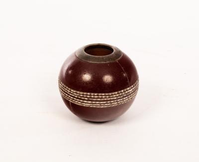 Appraisal: A Doulton Lambeth novelty match strike of cricket ball form