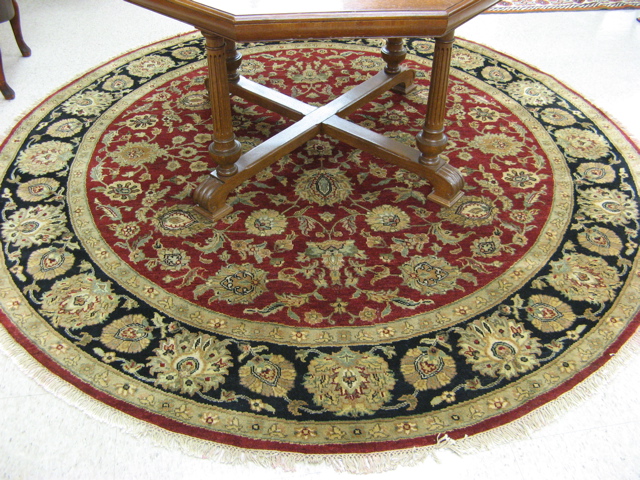 Appraisal: ROUND ORIENTAL CARPET Indo-Persian overall floral design on red ground