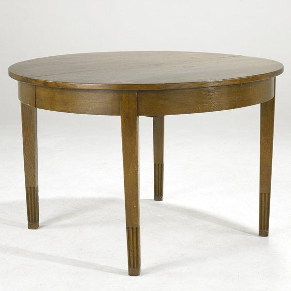 Appraisal: BRUNO PAUL Oak dining table with four tapering fluted legs