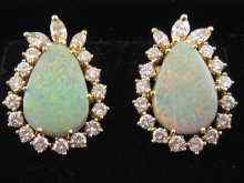 Appraisal: A pair of carat gold pear shaped opal and diamond