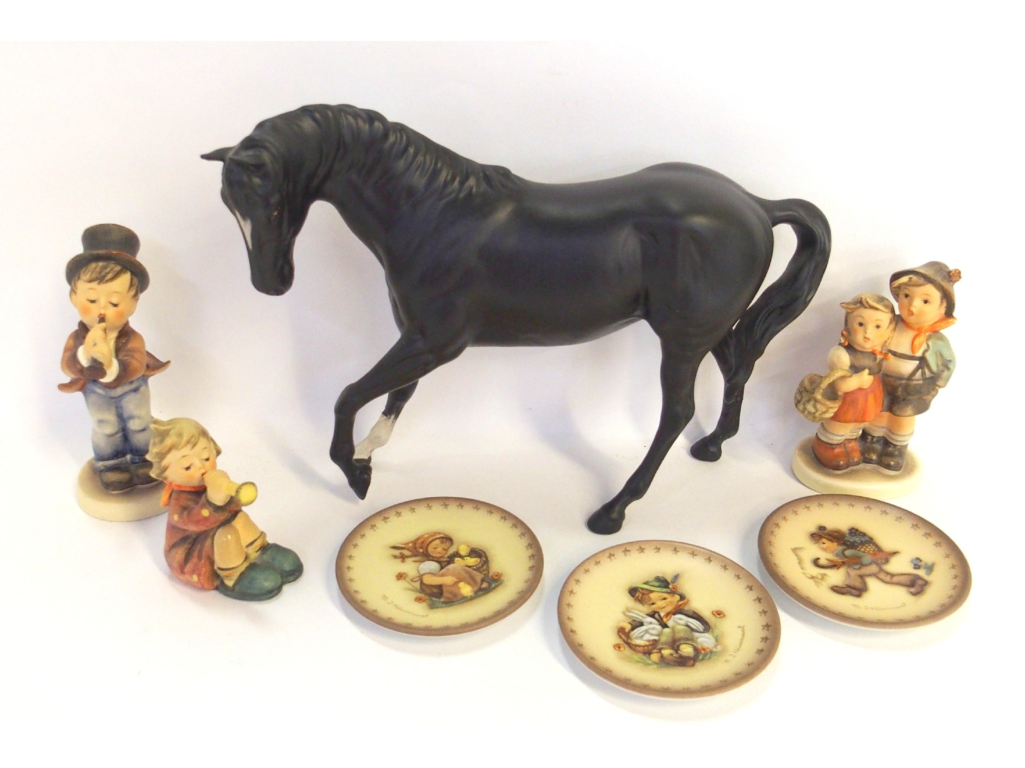 Appraisal: Beswick figure of a black stallion three Hummel figures and