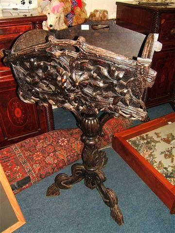 Appraisal: A Victorian carved dark stained oak planter the rectangular top