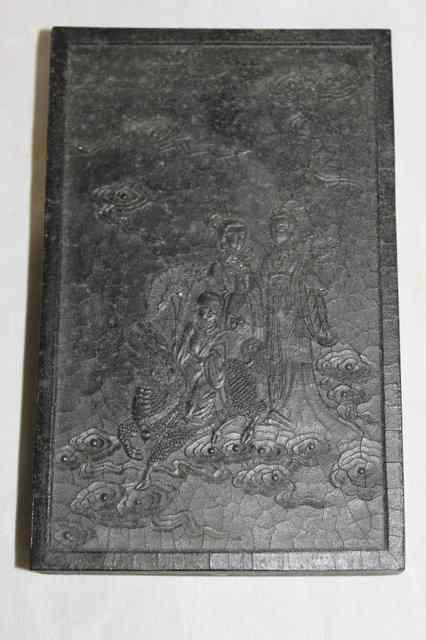 Appraisal: A CHINESE RECTANGULAR INK BLOCK with figure and stylised cloud