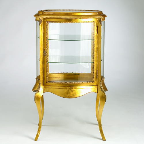 Appraisal: Gold leaf-covered vitrine in the French style with brass mounts