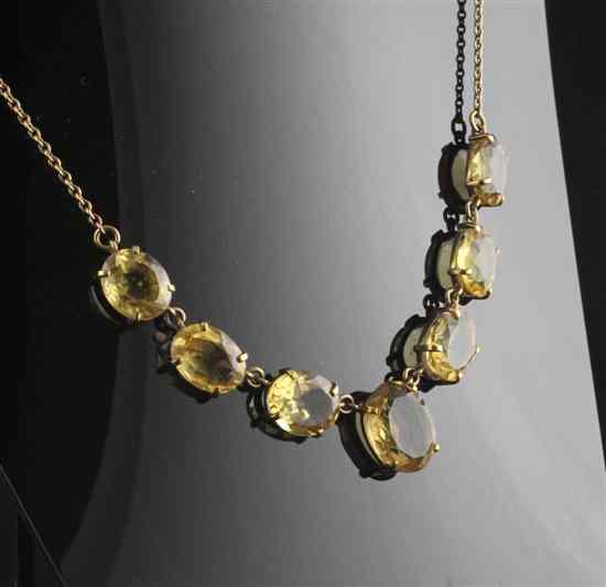 Appraisal: An Edwardian gold mounted citrine necklace set with seven graduated