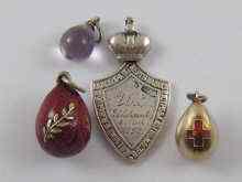 Appraisal: Two Russian silver pendant miniature eggs with enamelled decoration together