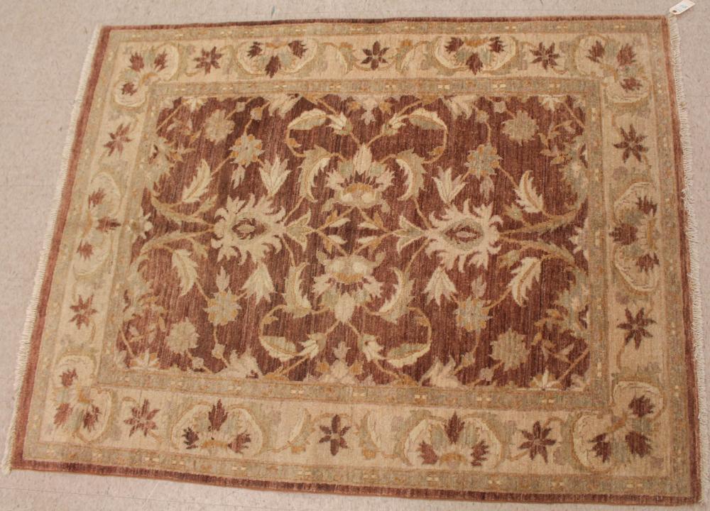 Appraisal: HAND KNOTTED ORIENTAL AREA RUG Pakistani-Persian floral design on purposely