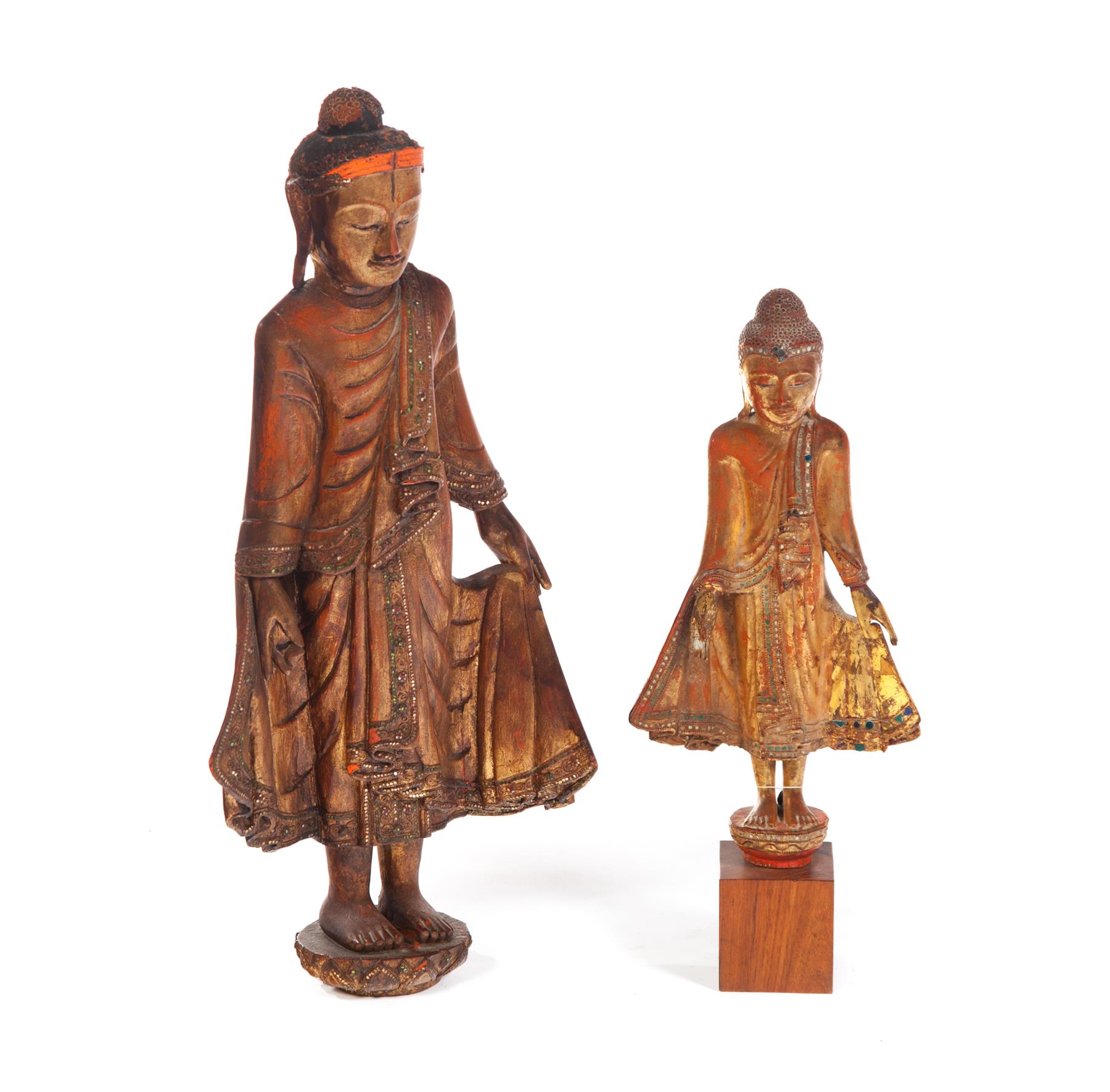 Appraisal: TWO CARVED INDONESIAN FIGURES Twentieth century Standing robed men with