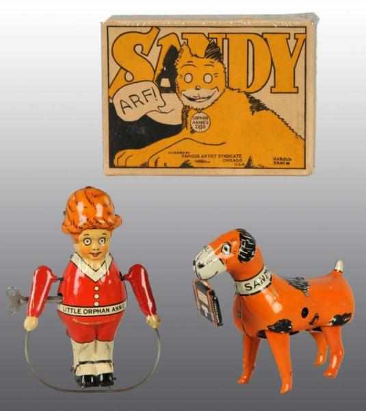 Appraisal: Tin Marx Orphan Annie Sandy Wind-Up Toys Description American Working