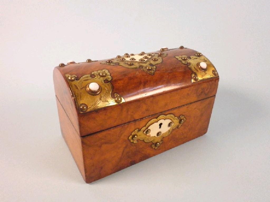 Appraisal: A Victorian walnut and brass tea caddy the domed hinged