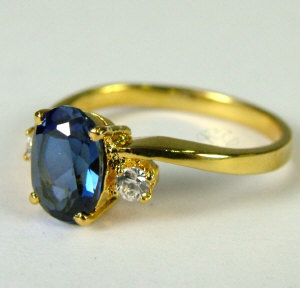 Appraisal: An ct gold sapphire and diamond three stone ring The