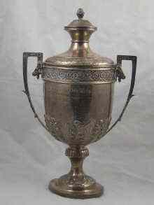 Appraisal: A two handled silver trophy cup and cover presented by