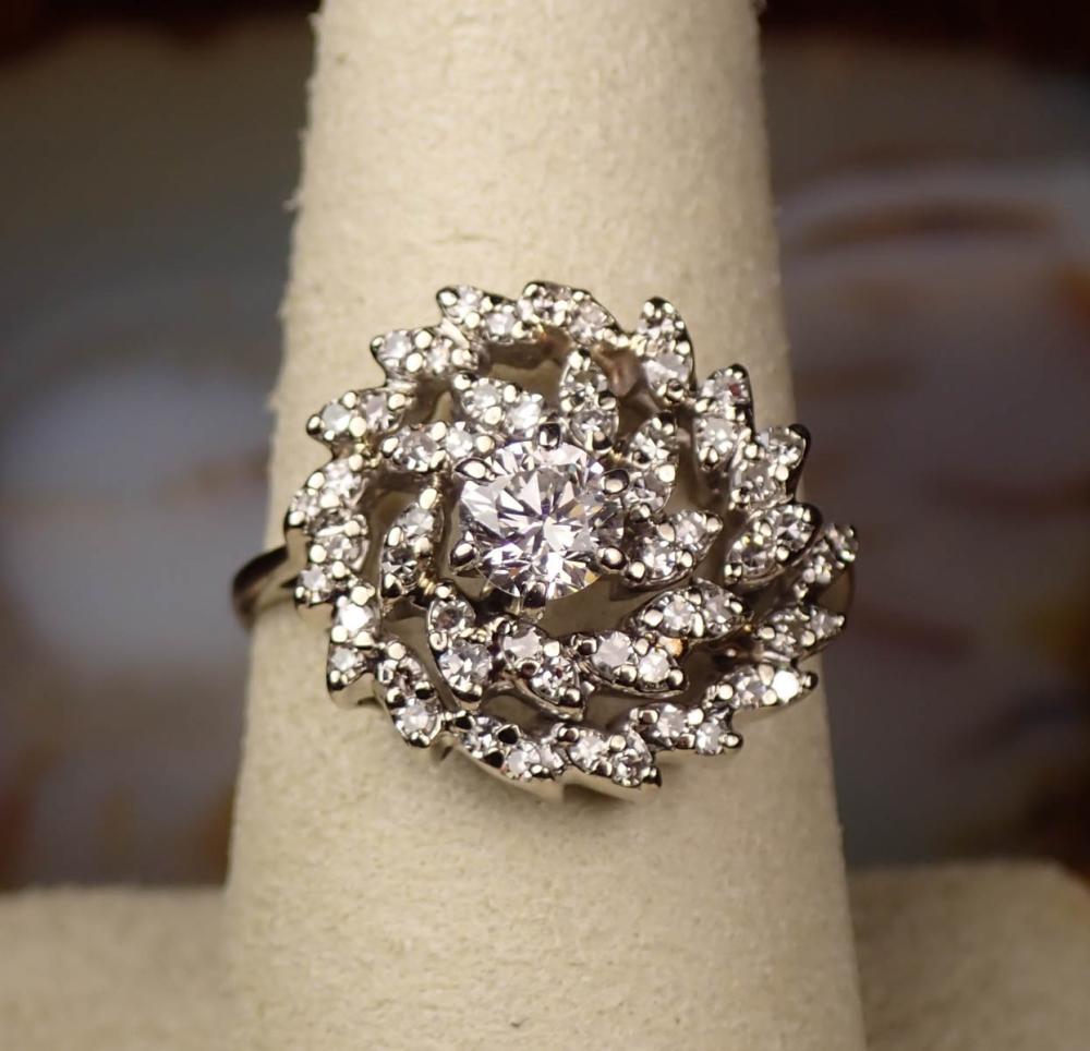 Appraisal: ESTATE DIAMOND AND FOURTEEN KARAT WHITE GOLD RING with round