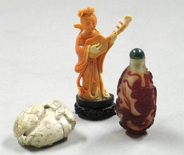 Appraisal: Three Chinese decorations Including a coral carving of a musician