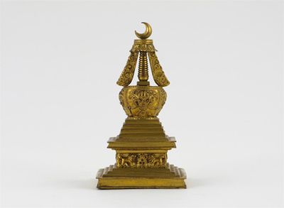 Appraisal: A gilt bronze model of a stupa with a crescent