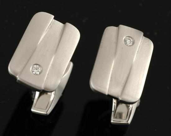 Appraisal: A pair of diamond cufflinks Each rectangular sectioned plaque set