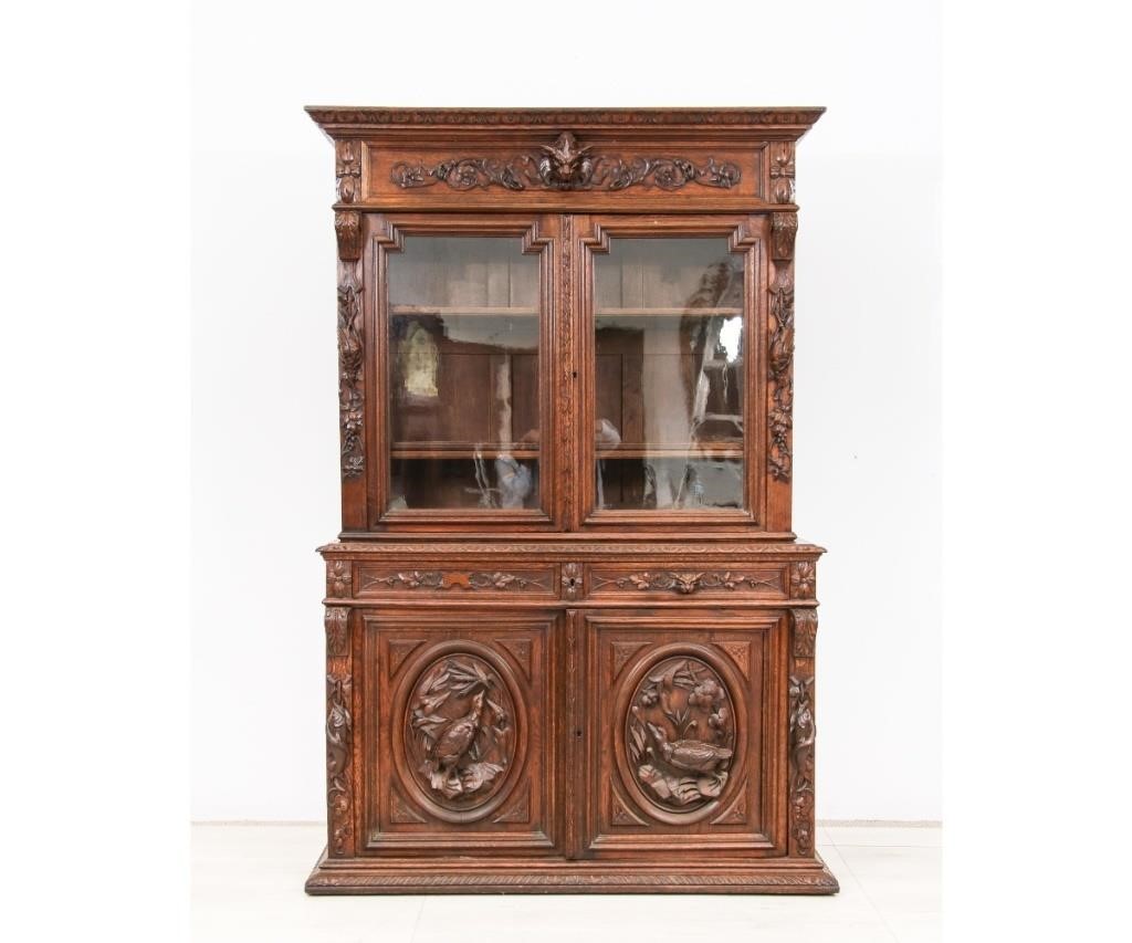 Appraisal: Massive French ornate oak two-piece cabinet late th c with