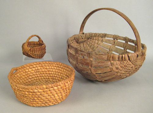 Appraisal: Pennsylvania split oak potato basket th c dia together with