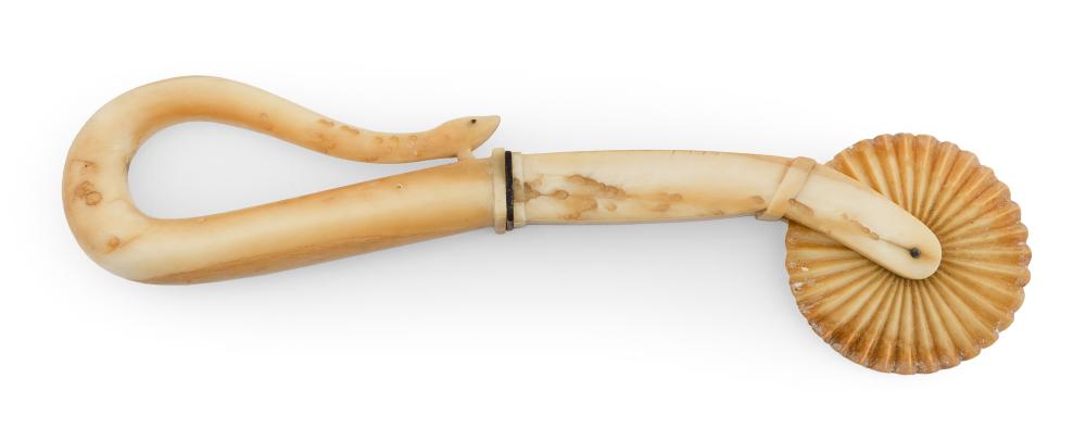 Appraisal: WHALE IVORY SNAKE-FORM PIE CRIMPER MID- TH CENTURY LENGTH WHALE