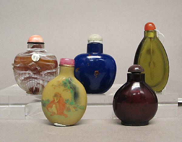 Appraisal: Five Peking glass snuff bottles The first of translucent olive