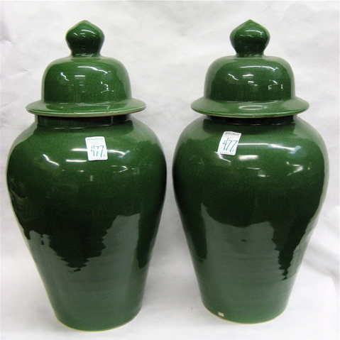 Appraisal: A PAIR OF CHINESE GREEN POTTERY POTICHES the baluster-shaped vessels