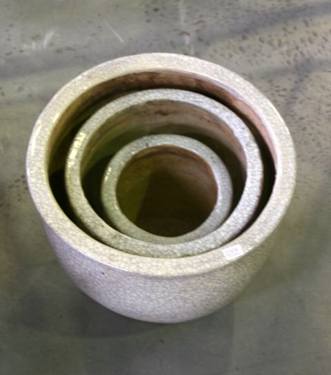 Appraisal: A set of three various sized planters grey crackle glaze