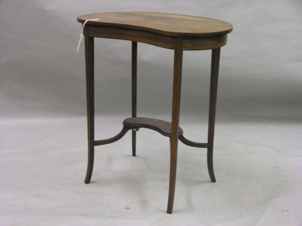 Appraisal: An Edwardian inlaid mahogany kidney shaped occasional table on square