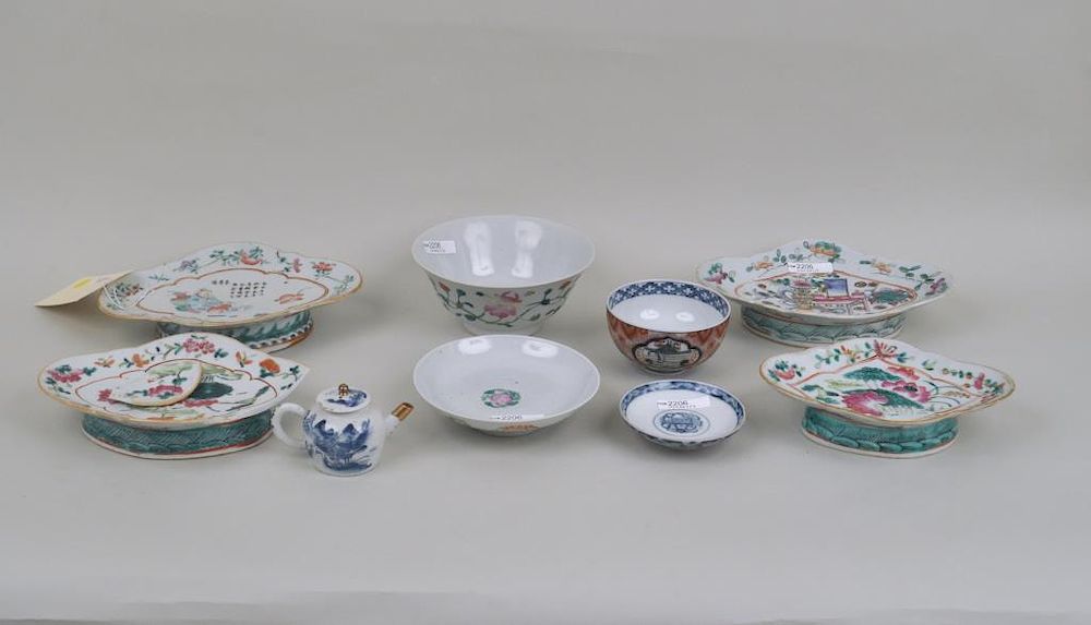 Appraisal: Group Eight Asian Porcelain Items comprising four Chinese enameled oval