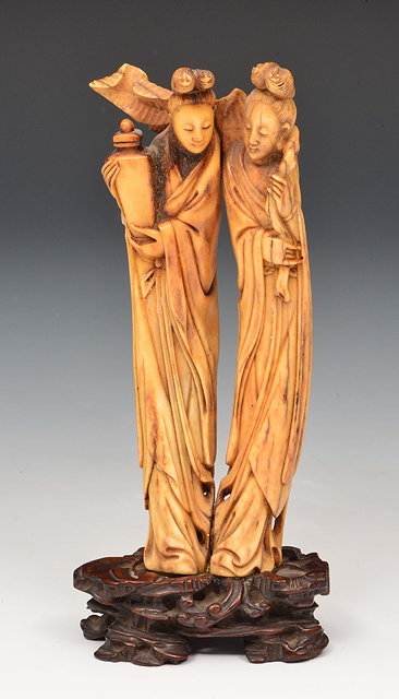 Appraisal: A Chinese stag antler carving of two standing female bodhisattvas